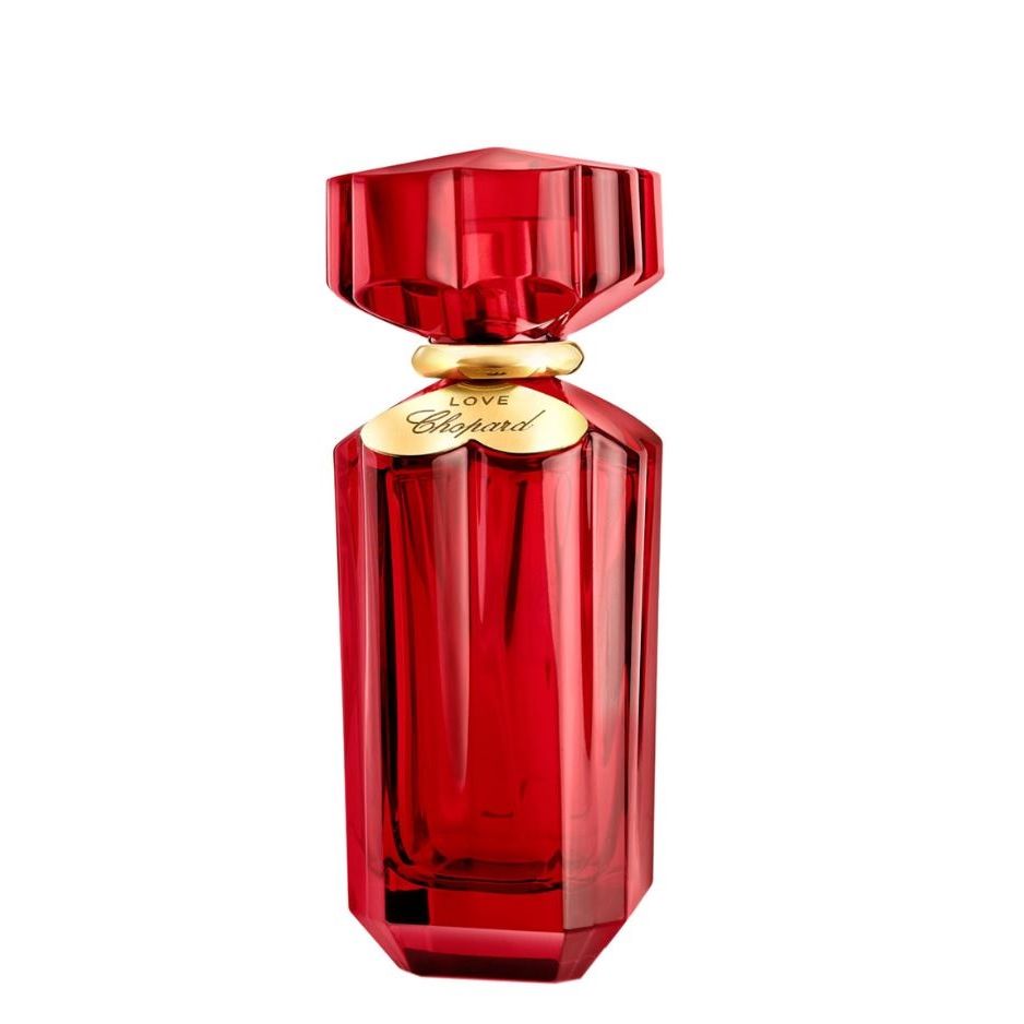 Red Chopard perfume bottle with gold accents, luxury fragrance product photography