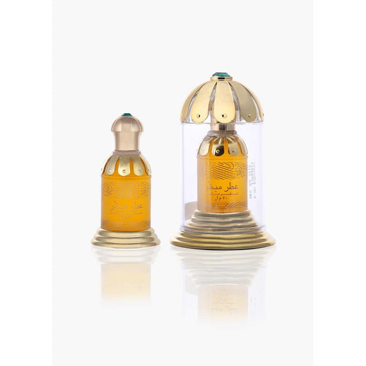 Luxury Arabic oud perfume bottles with gold caps and green gems, featuring ornate designs and Arabic script.