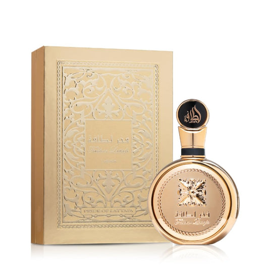 Elegant gold perfume bottle and embossed decorative box, luxury fragrance display