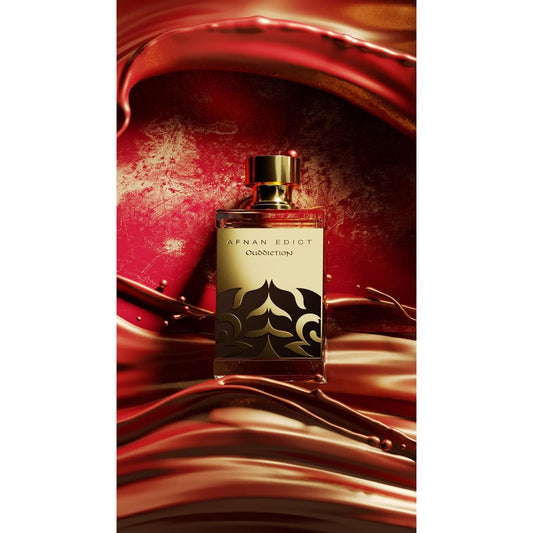 Afnan Edict Ouddiction perfume bottle with gold cap on swirling red and gold background