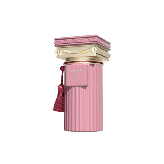 Pink luxury perfume bottle with gold accents, tassel, and pillar-inspired design