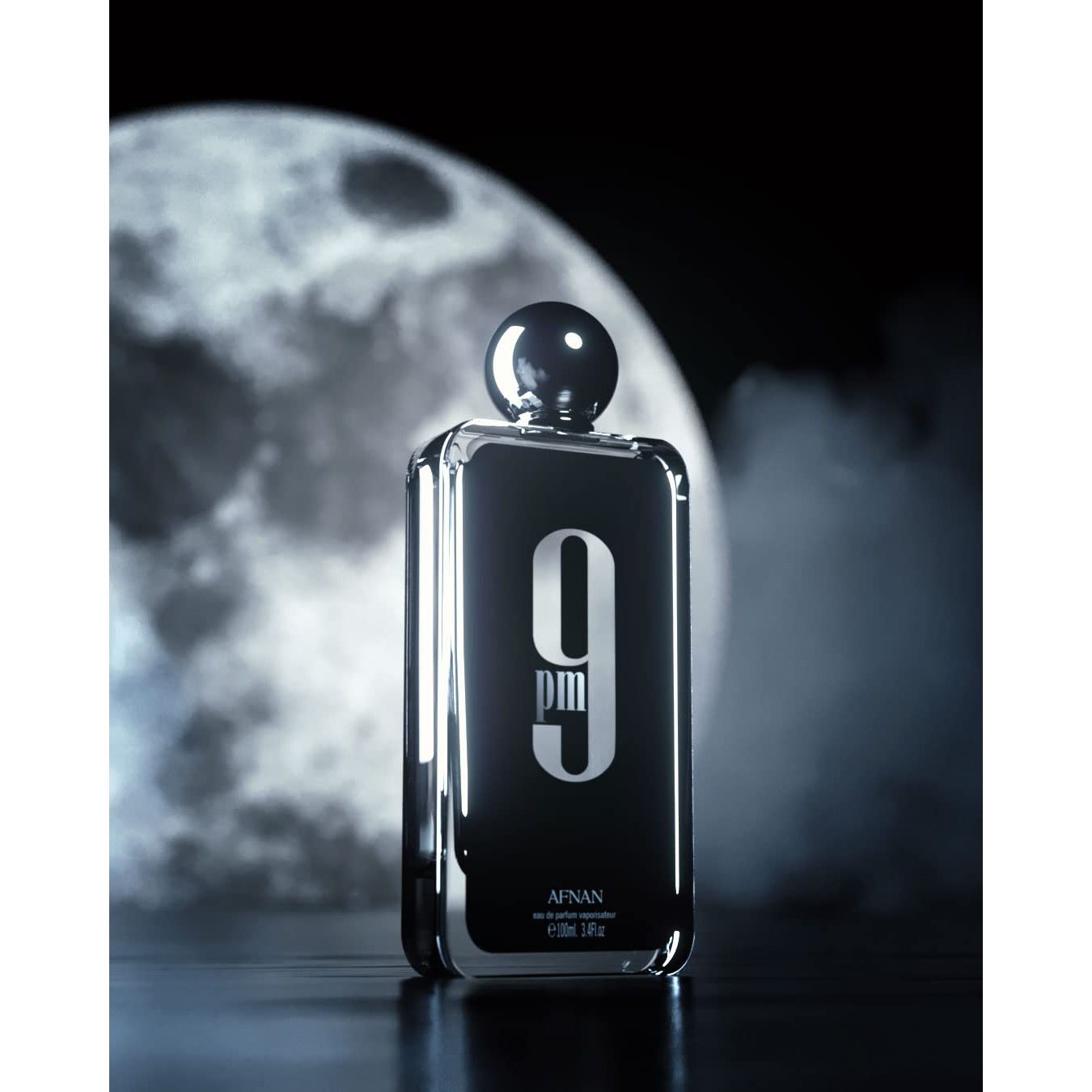 Afnan 9pm perfume bottle with black label, moonlit background and smoky atmosphere