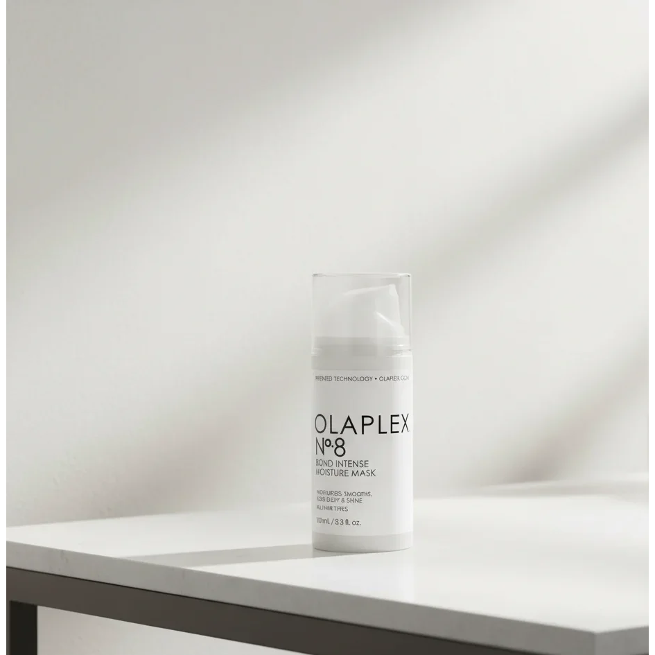Olaplex No.8 Bond Intense Moisture Mask bottle on a white table, hair treatment product