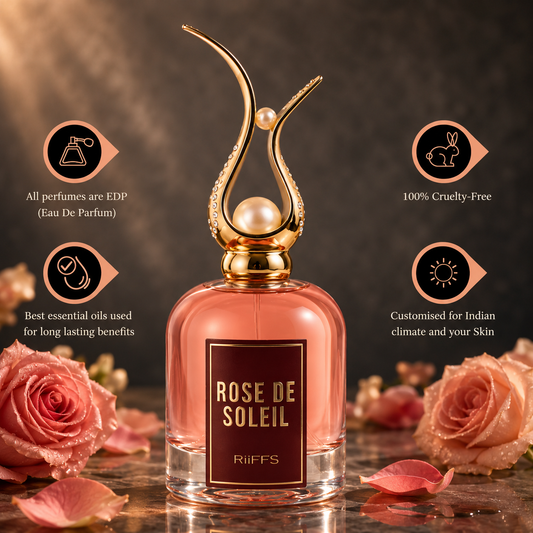 Rose De Soleil EDP perfume bottle with gold pearl cap, surrounded by pink roses, cruelty-free & long-lasting fragrance