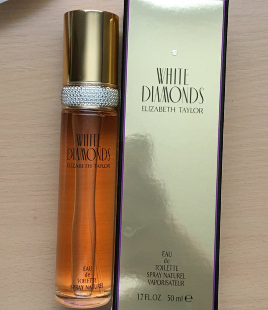 Elizabeth Taylor White Diamonds Eau de Toilette 50ml bottle with gold cap and crystal band, next to box