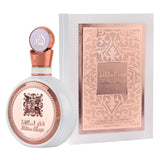 Elegant white and rose gold perfume bottle with Arabic script beside matching decorative box.