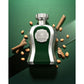 Luxury green and silver perfume bottle with nuts, spice sticks, and ginger on green background