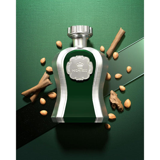 Luxury green and silver perfume bottle with nuts, spice sticks, and ginger on green background
