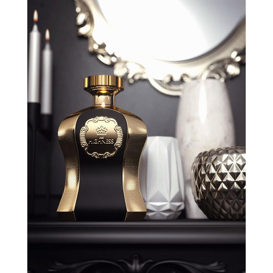 Luxury gold and black perfume bottle on elegant vanity with candles and decorative vases