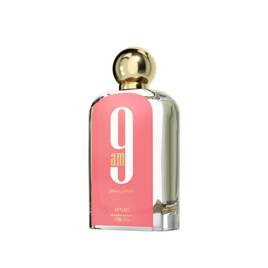Afnan 9am perfume bottle with gold cap and pink label on white background
