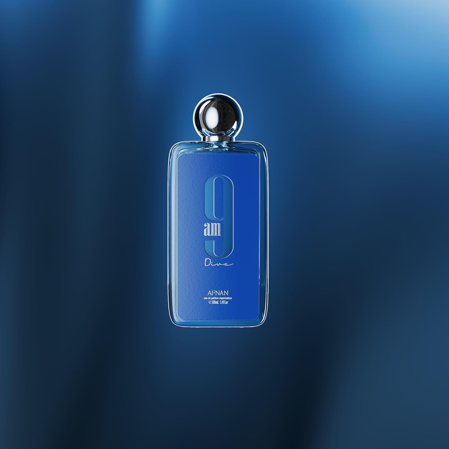 Afnan 9am Dive blue perfume bottle with silver cap on a blue gradient background