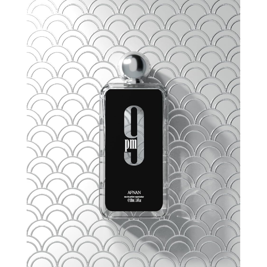 Afnan 9PM perfume bottle on silver art deco background, luxury fragrance product