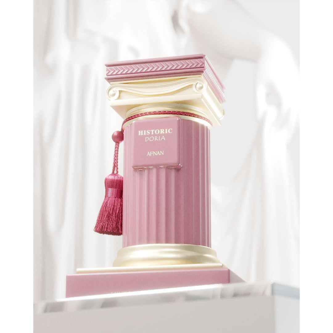 Luxury pink and gold perfume bottle shaped like a Greek column with tassel, labeled Historic Doria Afnan.