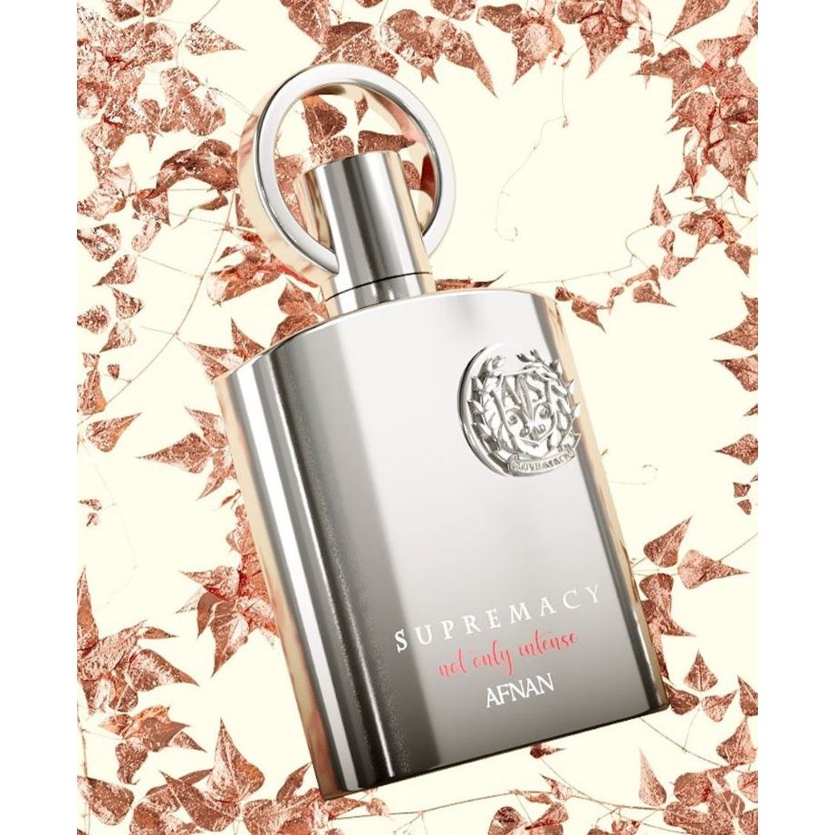 Luxury Supremacy perfume by AFNAN, sleek silver bottle with rose leaf backdrop, long-lasting oud fragrance