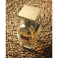 Violet Bouquet luxury perfume bottle with gold cap on woven texture, elegant designer fragrance