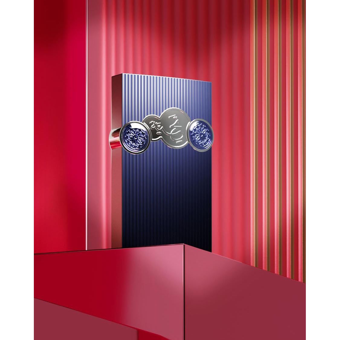 Luxury perfume bottle with blue crystal accents on red display, featuring Arabic script design