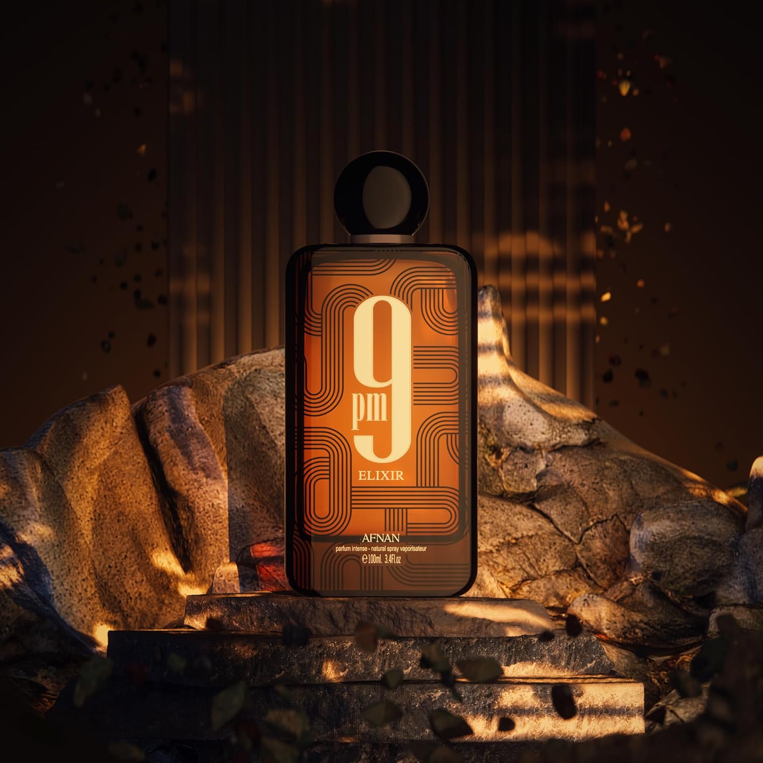 Afnan 9pm Elixir perfume bottle on rocks, warm lighting, bold graphic label, luxury fragrance
