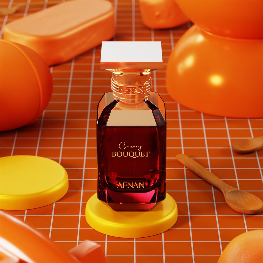 Afnan Cherry Bouquet perfume bottle with gold accents on orange background, surrounded by beauty accessories.
