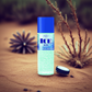 Ice Blue cool dab-on bottle for skincare resting on sandy desert ground with dry plants