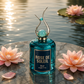Rose de Soleil Éclat Riiffs luxury perfume bottle with teal glass, elegant cap, and water lilies by water