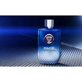 Blue glass perfume bottle labeled 'Pace Accelerate' on a textured metallic surface.